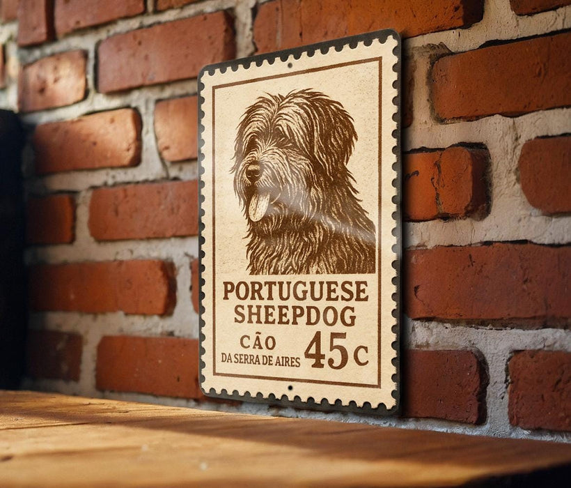 A Portuguese Sheepad dog stamp is displayed on a brick wall, with a wooden table below it.