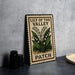 A vintage-style metal sign with the text "Lily of the Valley Patch" and an illustration of lily of the valley flowers.