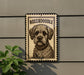a dog, specifically a Boxeroodle, which is a breed of dog known for its curly and dense coat.