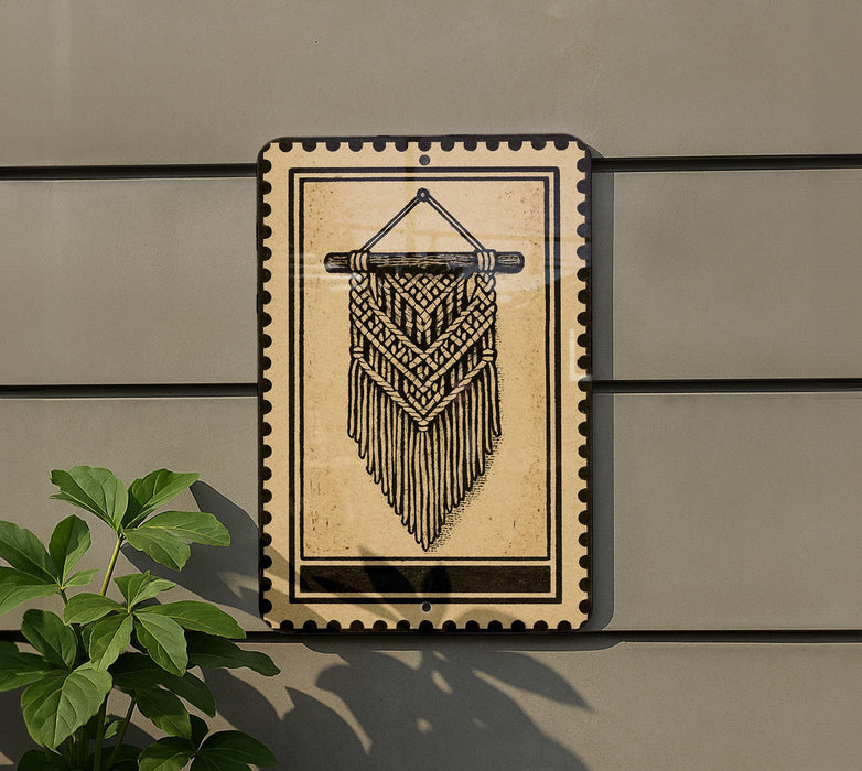 a decorative hanging piece with a geometric pattern, mounted on a wall next to a plant.