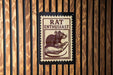 A sign with the word "RAT ENTHUSIAST" printed on it, featuring an illustration of a mouse on a hand.