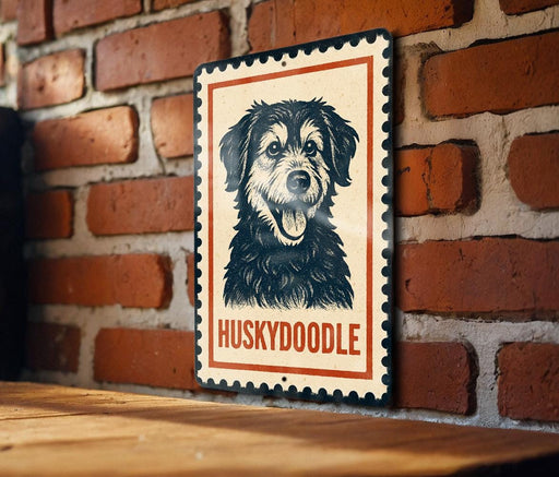 A metal sign featuring a black and white illustration of a husky dog with the word "Huskydoodle" written below it.