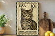 A vintage American Shorthair cat stamp is displayed on a shelf, surrounded by kitchen utensils and a potted plant.