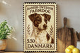 A wooden shelf displaying a framed image of a Danish-Swedish Farmdog, a breed of dog known for its distinctive appearance.