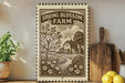 a decorative sign for Spring Blossom Farm, with a tree and a house depicted in a vintage style. The sign is placed on a wooden surface, surrounded by various kitchen utensils and a potted plant.