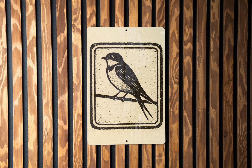 A sign featuring a black and white illustration of a bird perched on a branch.