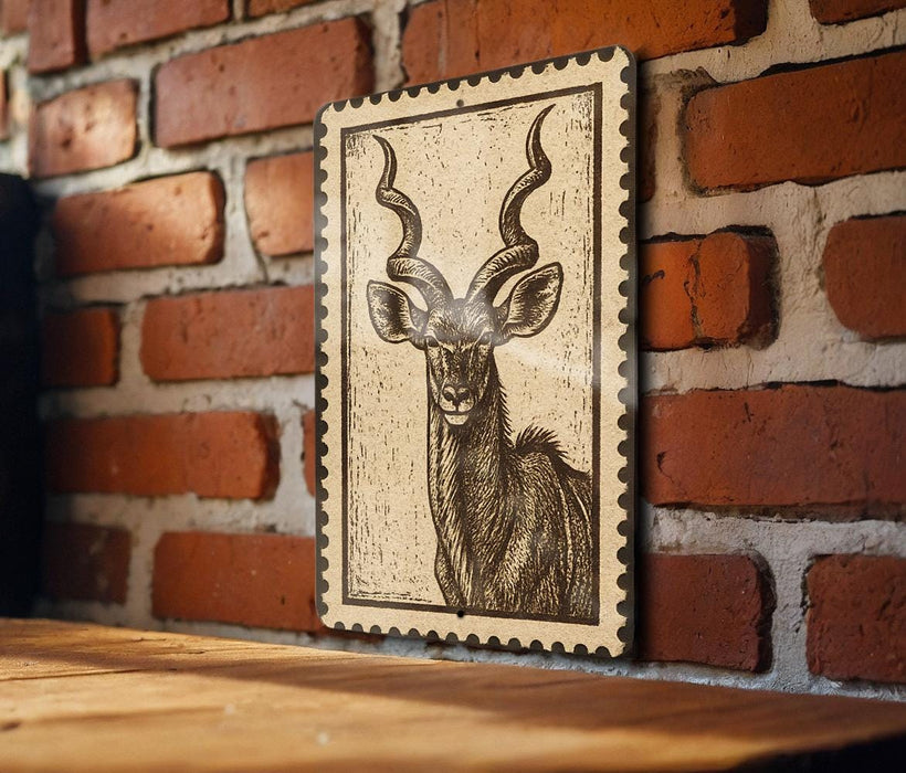 a wooden table with a framed illustration of a horned animal, likely a deer or antelope, mounted on a brick wall.
