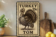 A vintage-style turkey stamp with the text "TURKEY 25c TOM" is displayed on a shelf, accompanied by a wooden cutting board and a potted plant.