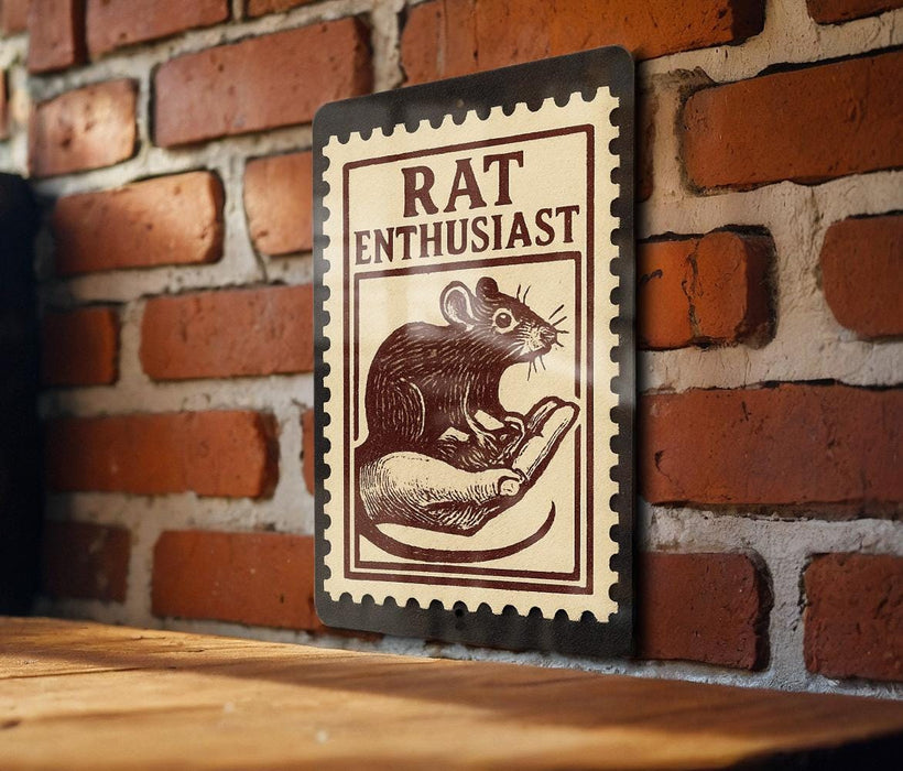 A metal sign with a stamp-like design hangs on a brick wall, featuring a mouse and the text "RAT ENTHUSIAST".