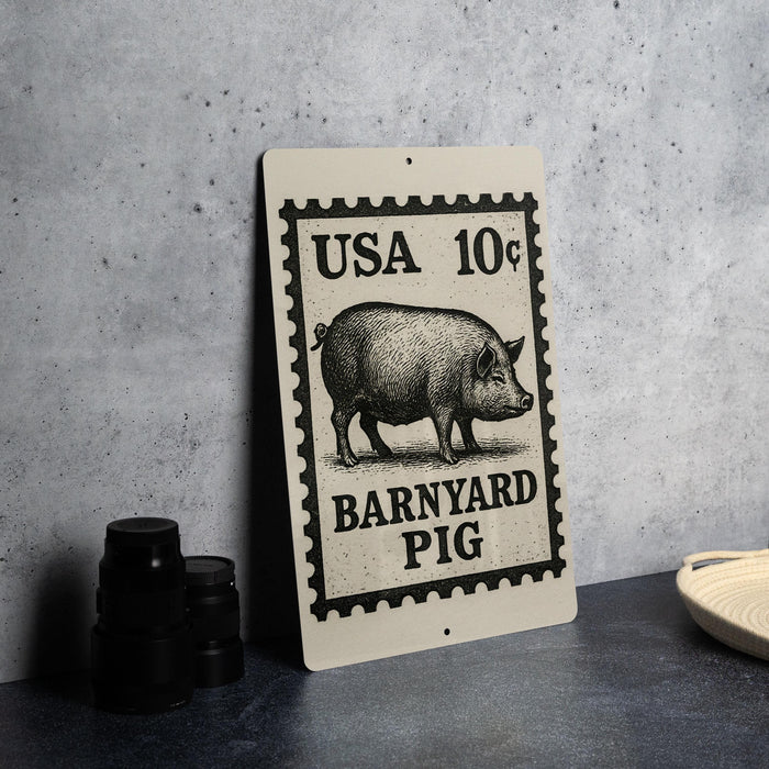 A sign featuring a pig illustration and text, placed on a table next to some black camera lenses.