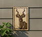 a large, detailed illustration of a horned animal, possibly a deer or a gazelle, mounted on a wall.