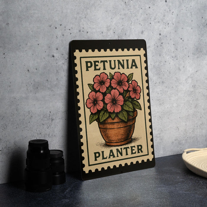 A metal sign with a floral design and the text "PETUNIA PLANTER" is displayed on a table.