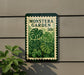 A sign for the Monstera Garden, featuring a large image of a monstera plant with a postage stamp-like border.