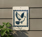 a white sign with a blue border, depicting a bird in flight, mounted on a wall.