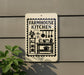a sign for a "Farmhouse Kitchen" mounted on a wall, with various kitchen-related icons and illustrations on the sign.