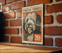 A wooden table with a wooden surface, and a framed poster of a Tibetan Terrier dog on the wall.