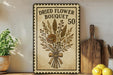 a decorative sign with a floral design, placed on a shelf next to a wooden cutting board and some lemons.