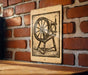 a wooden table with a sign depicting a spinning wheel on the wall behind it.
