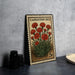 A vintage-style stamp depicting a bouquet of red carnation flowers, with the text "Carnation Bed" printed on it.