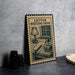 a letter writing desk with a lamp, pen, and books, as depicted on a stamp-like frame.
