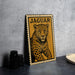 A metal sign featuring a leopard illustration and the word "JAGUAR" is displayed on a table.
