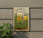 a sign for an aromatic garden, with a vibrant illustration of various plants and flowers.