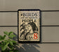 a sign with the text "#BIDS ARE MY FAVORITE PEOPLE USA 8" and an illustration of a woman with birds on her shoulder.