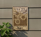 a wooden sign with a floral design, mounted on a wall next to a plant.