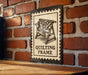 Quilting Frame Metal Sign – Vintage Stamp Style Wall Art for Quilters, Rustic Sewing Room Decor, Gift for Quilt Lovers