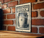 A sign for "Stoneware Crock" is displayed on a brick wall, featuring an illustration of a crock pot.