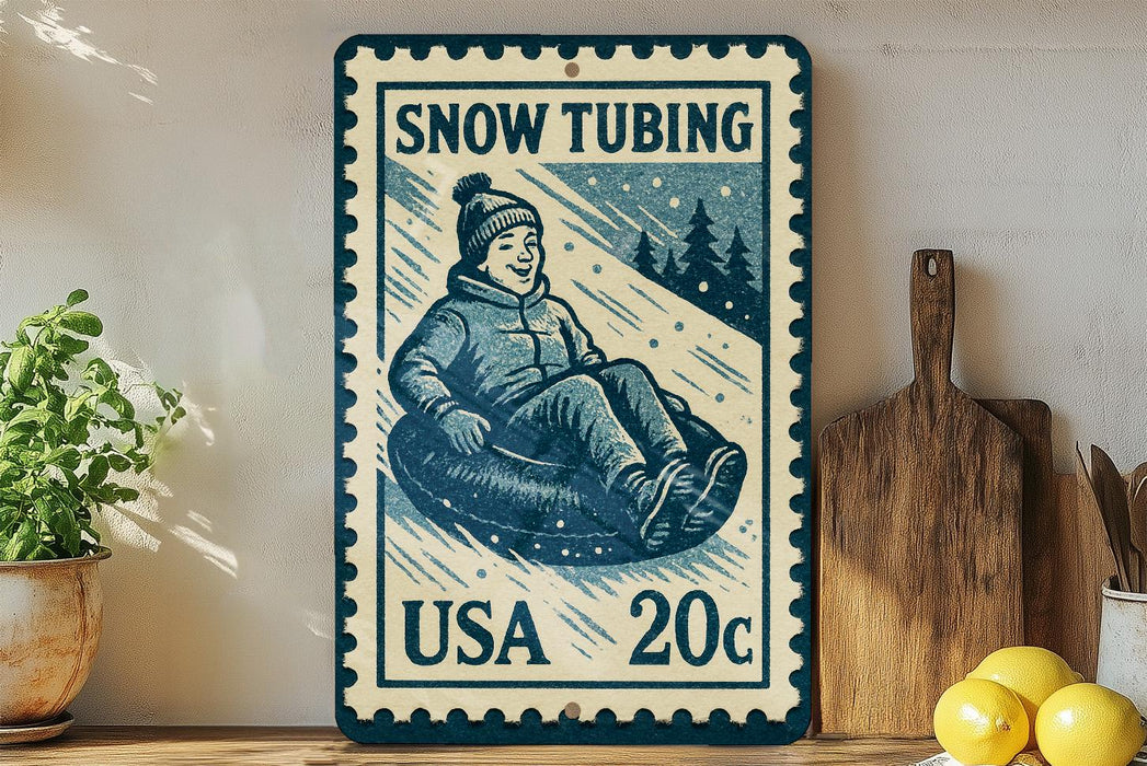 A vintage-style snow tubing postage stamp from the United States, featuring a smiling child in a snow tube.