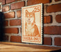 A wooden table with a wooden border, and a wooden wall with a brick pattern. There is a wooden sign with an image of a Shiba Inu dog and the text "SHIBA INU" on it.
