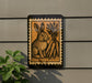 a sign with a rabbit and carrots on it, mounted on a wall.