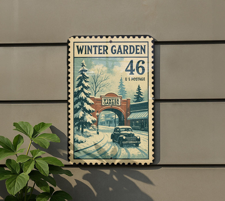 A vintage-style metal sign with a winter garden scene, featuring a car driving through a snowy landscape with a brick archway.