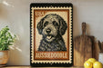 A framed image of a black and white Aussiedoodle dog, with the text "USA AUSSIEDODOLE" on the frame.