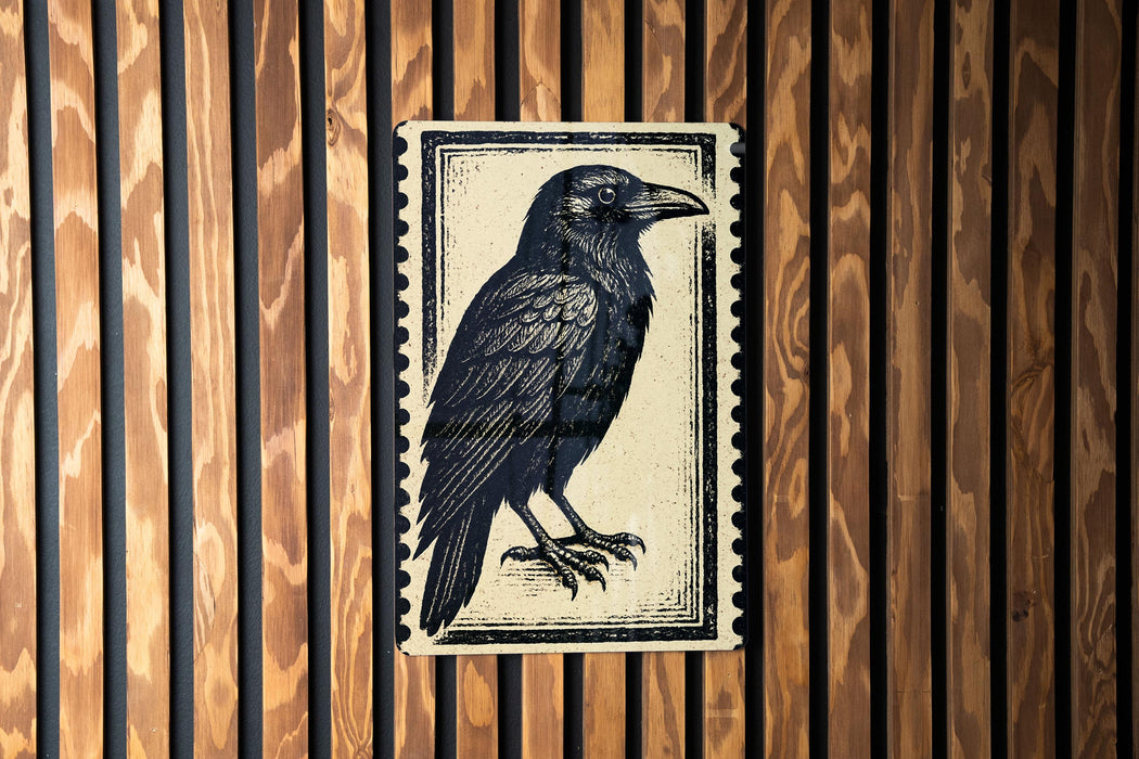 a black and white illustration of a bird, specifically a crow, mounted on a wooden wall.