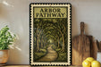 A framed illustration of a forest path, with the text "ARbor Pathway" prominently displayed, is hanging on a wall next to a wooden cutting board and a potted plant.
