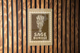 A sign with the text "SAGE BUNDLE" is displayed on a wooden wall.
