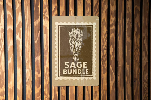 A sign with the text "SAGE BUNDLE" is displayed on a wooden wall.