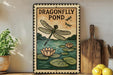 A framed illustration of a dragonfly over a pond with lily pads, accompanied by the text "DRAGONFLY POND".