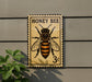 A vintage-style postage stamp featuring a bee, with the text "HONEY BEER" and the value of 3 cents.