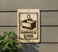 a sign that reads "FARMHOUSE SINK" with a picture of a sink on it.