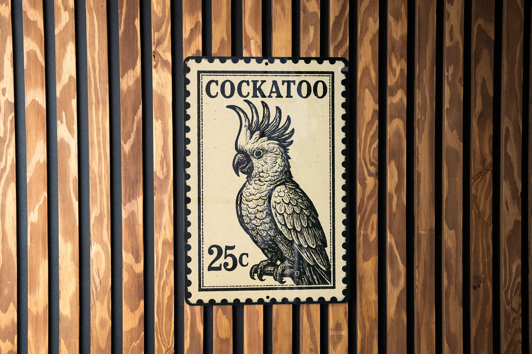 A black and white postage stamp featuring a cockatoo, with the text "COCKATOO" and the value "25c" printed on it.