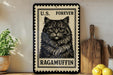 A framed image of a cat, specifically a Ragamuffin, is displayed on a shelf next to a wooden cutting board and some lemons.