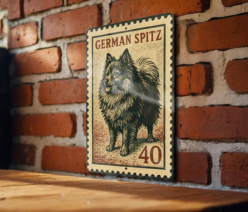 A metal sign featuring a German Spitz dog, with the number 40 below it, is mounted on a brick wall.