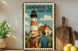 A vintage-style postage stamp depicting a lighthouse and a couple, with the text "LIGHTHOUSE 32 VISIT USA" on it.