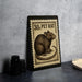 A metal stamp featuring a detailed illustration of a pet rat, with the text "30¢ PET RAT" printed on it.