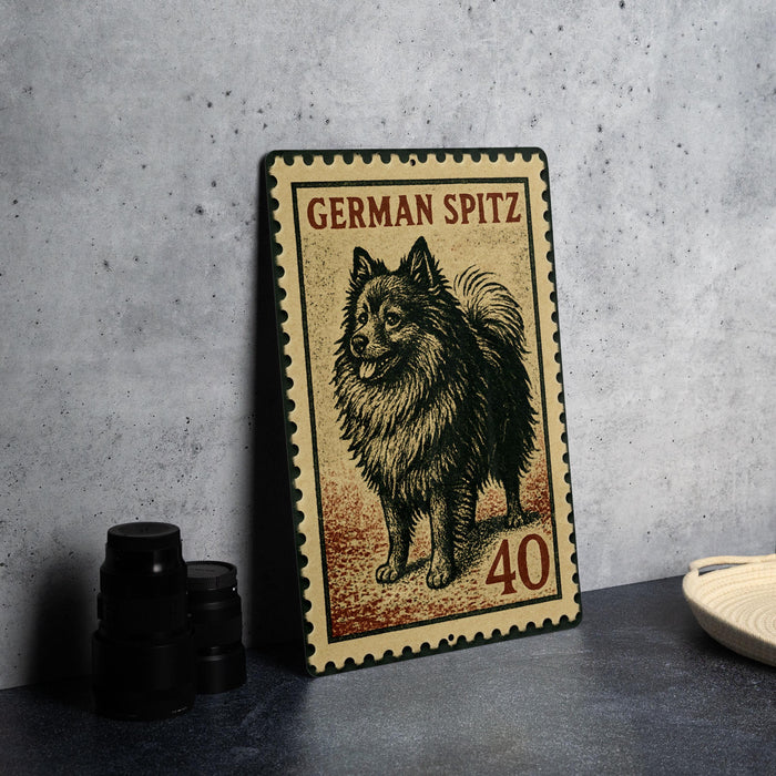 A metal stamp featuring a German Spitz dog, with the number 40 below it.