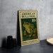 A metal stamp featuring an illustration of a bullfrog, with the text "AMERICAN BULLFROG 10¢" printed on it.