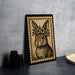 A framed illustration of a rabbit wearing a flower crown is displayed on a table.